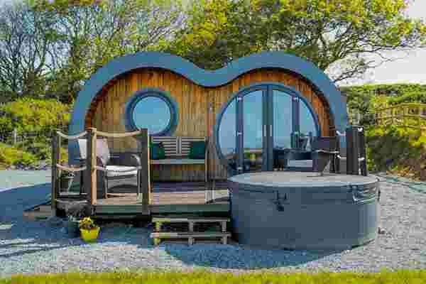 This tiny cabin looks like a minion-inspired hobbit pod for an outdoorsy glamping getaway!