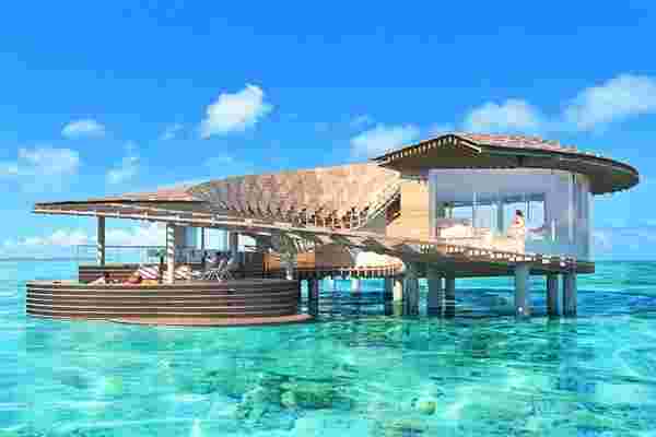 This solar-powered luxury resort has 100 sustainably designed villas spread over 90 islands that boost eco-toursim!